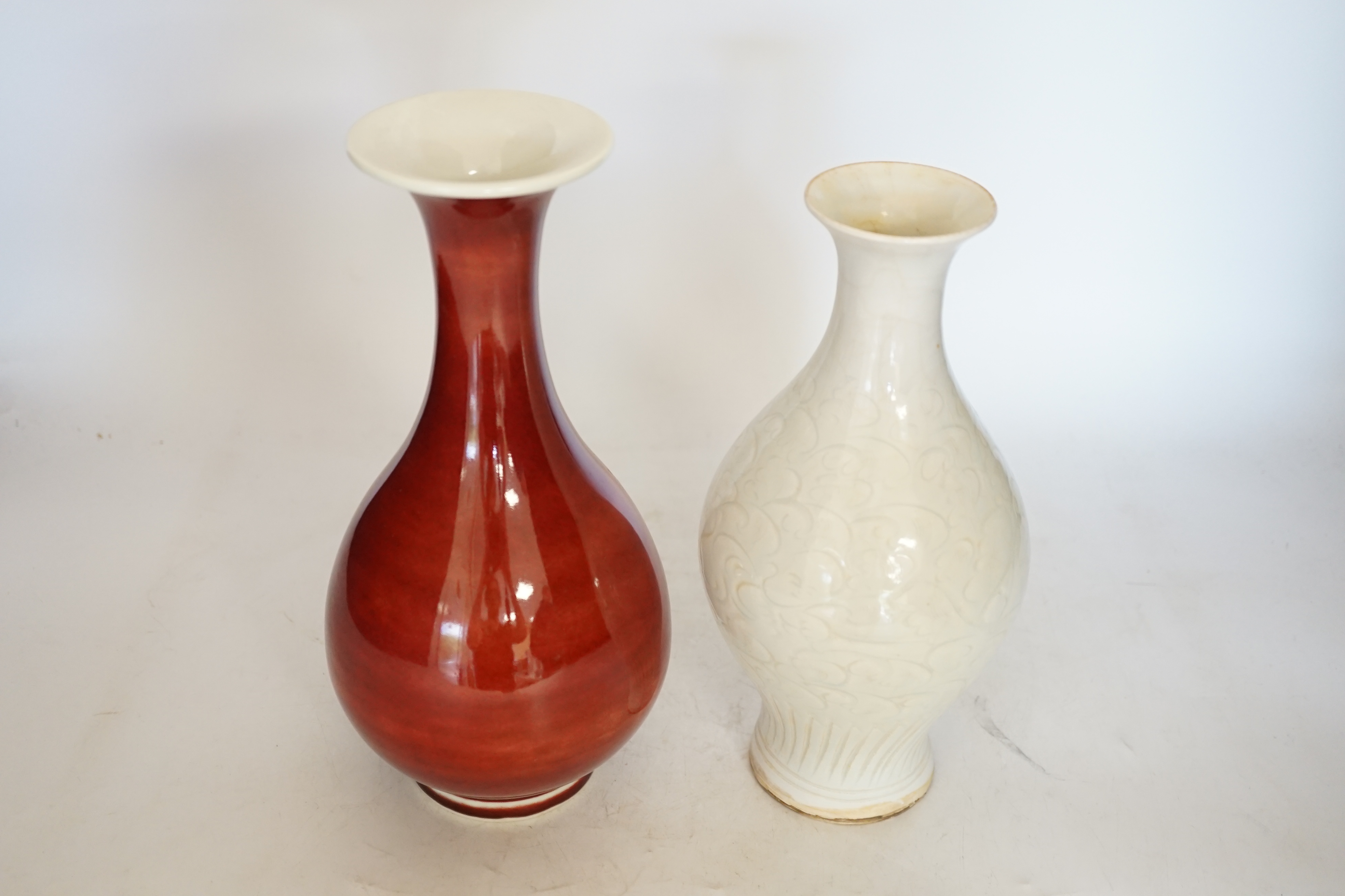 Two Chinese vases including a sang de boeuf example, largest 25cm high. Condition - larger example good, other with crazing